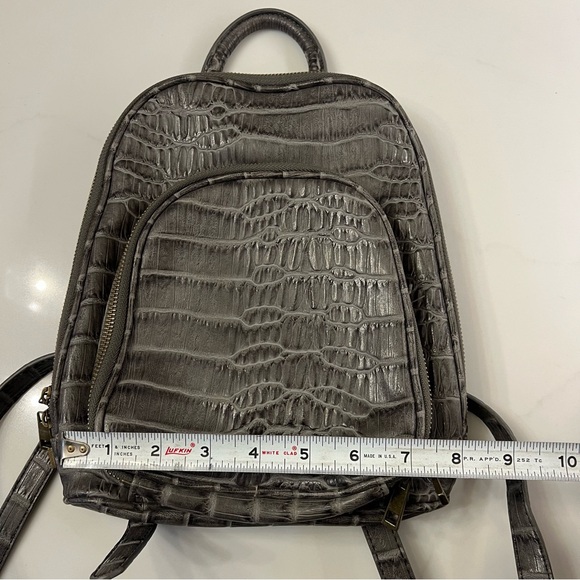 cooper faux crocodile embossed leather backpack Saint Laurent Lambskin Festival Black 1914646 FASHIONPHILE An elegant everyday backpack crafted from embossed calfskin leather and polished gold hardware Free People Develle Mini Backpack